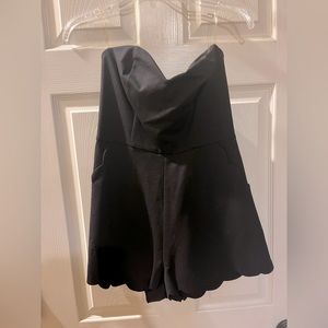 Black sleeveless romper, scalloped trim, large